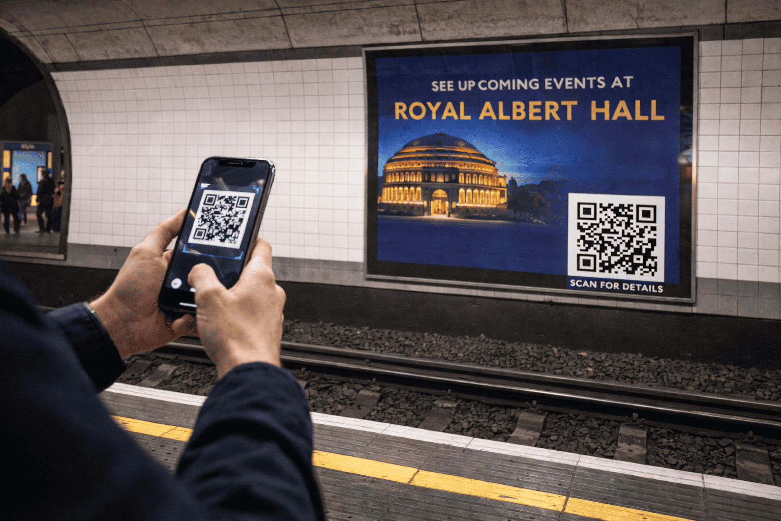 phone scanning a QR Code of upcoming events at the Albert Hall, in a tube station.